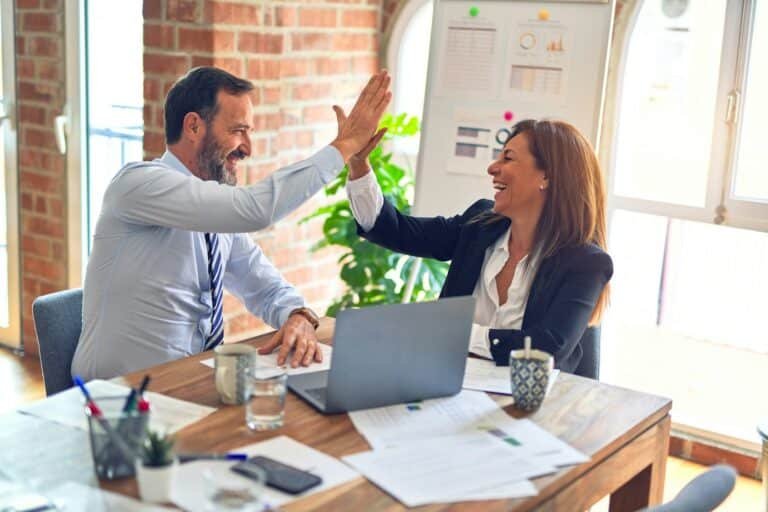 Business owner reviewing website ownership and handover documents with a developer