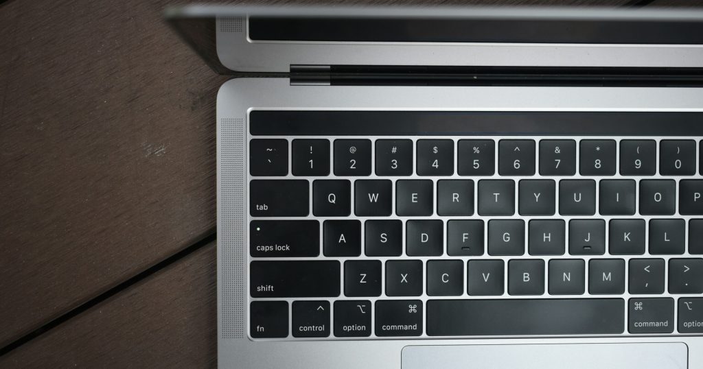 jourdan-wee-T8K7c2JFCgo-unsplash Open laptop showing blog editor and keyword tools